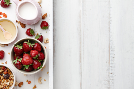 Healthy cereal breakfast with fresh strawberry and honeyの写真素材