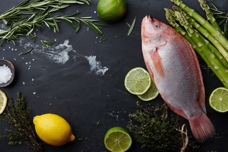 Raw red tilapia fish cookingの写真素材