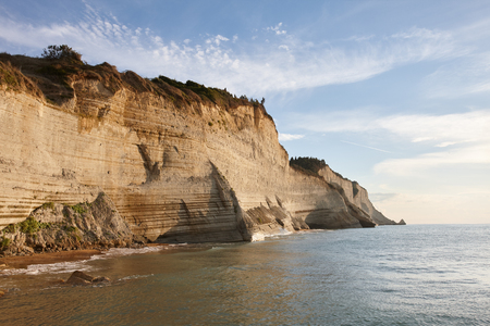 Beautiful coastline with cliffs in Corfu, Greece. Unique geological formations in Peroulades region.の写真素材