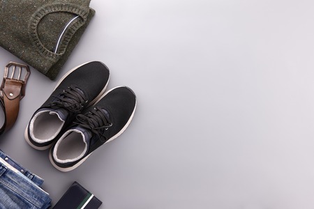 Mens summer casual clothing outfits and accessories flat lay on gray background, top viewの写真素材