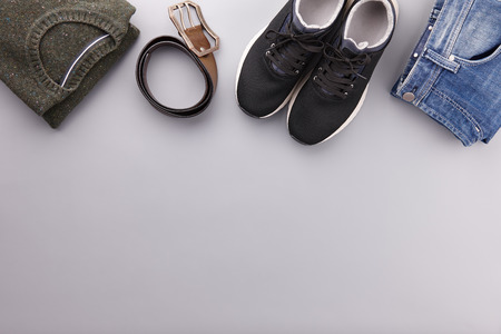 Mens summer casual clothing outfits and accessories flat lay on gray background, top viewの写真素材