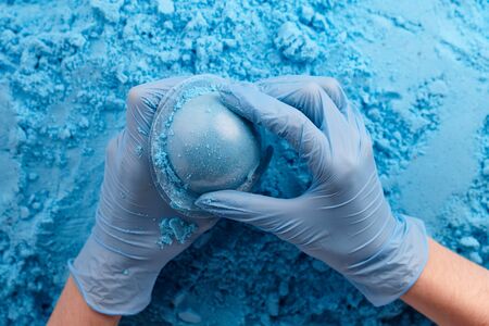 Making bath bombs from dry mixture. Cosmetics manufacture.の写真素材