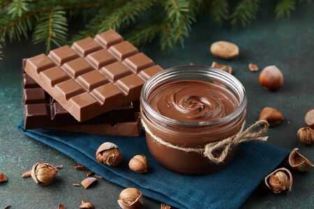 Chocolate spread or nougat cream with hazelnuts in Christmas timeの写真素材
