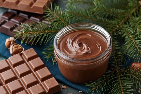 Chocolate spread or nougat cream with hazelnuts in Christmas timeの写真素材