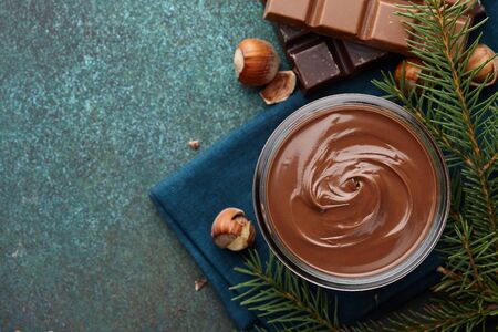 Chocolate spread or nougat cream with hazelnuts in Christmas timeの写真素材