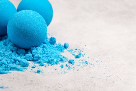 Blue bath bombs on white tabletop, close up viewの写真素材