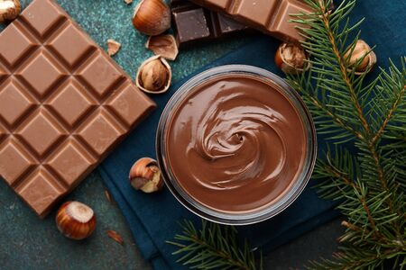 Chocolate spread or nougat cream with hazelnuts in Christmas timeの写真素材