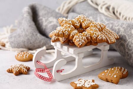 Christmas gingerbread cookies on white wooden sledge, holiday conceptの写真素材