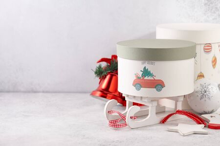 Gift boxes and Christmas toys on white table, holiday conceptの写真素材
