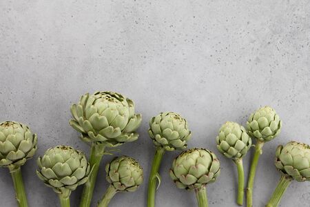 Fresh green artichokes on gray background, copy spaceの写真素材