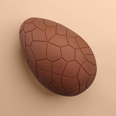 Chocolate Easter egg on beige background, close up viewの写真素材