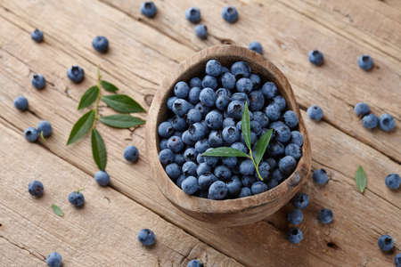 Fresh blueberries in wooden bowl, healthy organic foodの写真素材