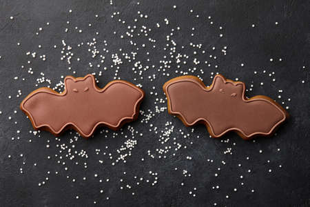 Funny Halloween gingerbread biscuits on black background