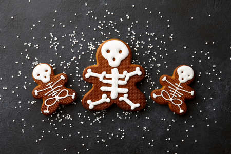 Funny Halloween gingerbread biscuits on black backgroundの写真素材