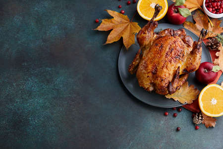 Roasted turkey or chicken for Thanksgiving dinner. Holiday preparation.の写真素材
