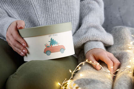 Woman holding vintage Christmas box, holiday conceptの写真素材
