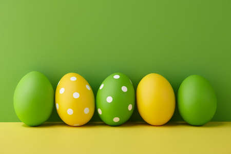 Painted Easter eggs on green and yellow background, spring holiday preparationの写真素材