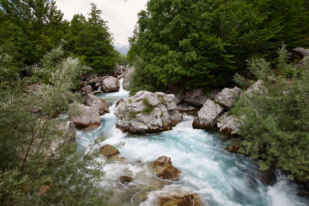 Blue waters of mountain river in Valbone valley, Albaniaの写真素材