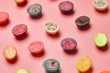 Colorful shortbread cookies with filllings on pink backgroundの写真素材