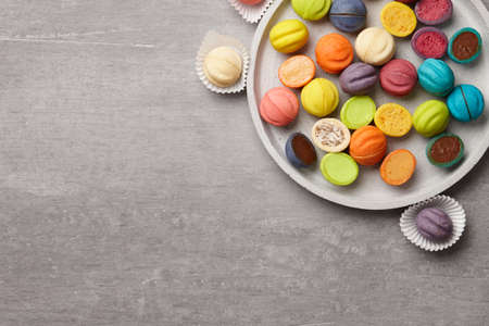 Colorful shortbread cookies on gray concrete backgroundの写真素材