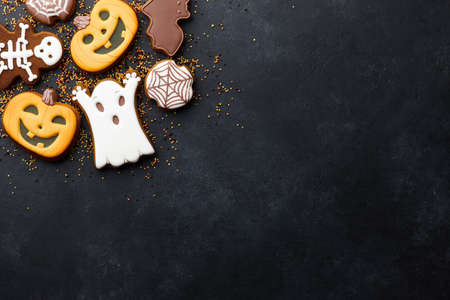 Funny Halloween gingerbread biscuits on black backgroundの写真素材