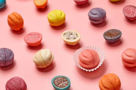 Colorful shortbread cookies with filllings on pink background, close up viewの写真素材