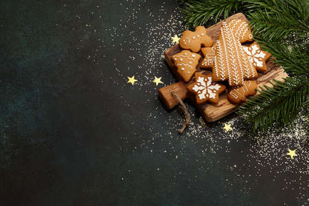 Christmas gingerbread cookies on textured table backgroundの写真素材
