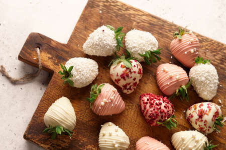 Chocolate dipped strawberries on wooden backgroundの写真素材