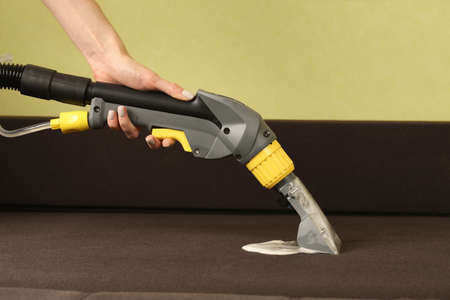 Deep professional cleaning of sofa with vaccum cleanerの写真素材