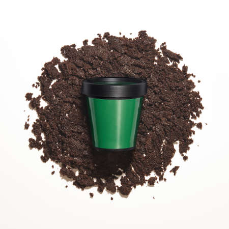 Plastic container with coffee scrub on white backgroundの写真素材