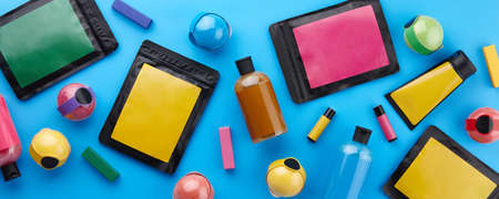 Various body care products and other cosmetics on blue backgroundの写真素材
