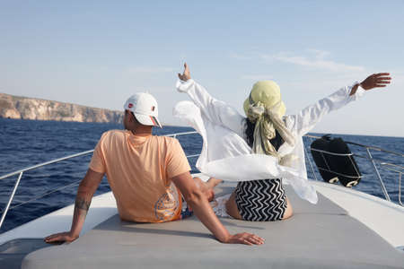 Young couple resting on a yacht in the sea in Zakynthosの写真素材