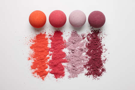 Set of multicolored bath bombs on a white background