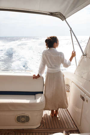 Woman on white yacht in the sea during summer vacation. Zakynthos, Greece.の写真素材