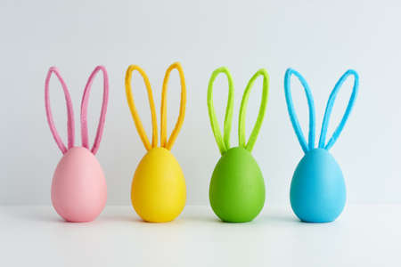 Colorful Easter eggs with bunny ears. Creative holiday decoration diy idea.の写真素材