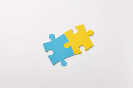 Ukrainian colors puzzle pieces on white background