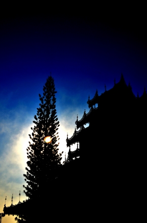 Silhouette of Buddhist Temple in the Sunrise の写真素材