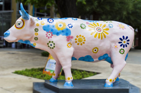 Artificial Cow with Colourful Painting Flowersの写真素材