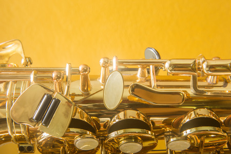 Saxophone on the yellow backgroundの写真素材