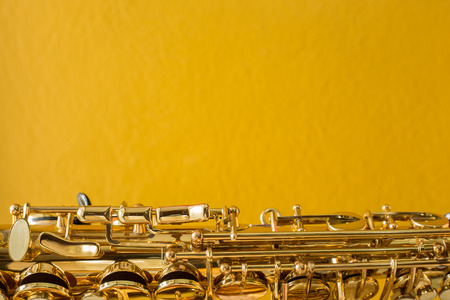 Saxophone on the yellow backgroundの写真素材