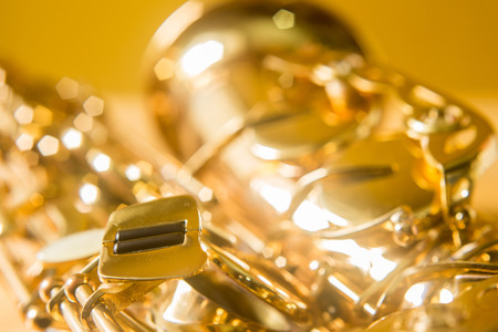 Saxophone on the yellow backgroundの写真素材