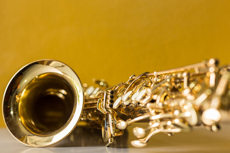 Saxophone on the yellow backgroundの写真素材