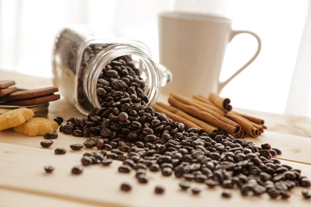 Coffee bean and cinnamon on the wood tableの写真素材