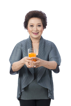 Portrait of Asian senior woman isolated on whiteの写真素材