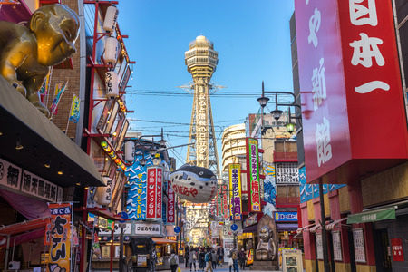 Osaka, Japan - November 27, 2015: Tsutenkaku is a symbol of a new world in Osaka which was built in 1912.  Tourists come enjoy restaurants and bars in this area.のeditorial素材