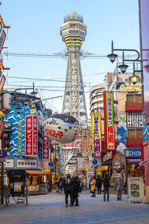 Osaka, Japan - November 27, 2015: Tsutenkaku is a symbol of a new world in Osaka which was built in 1912.  Tourists come enjoy restaurants and bars in this area.のeditorial素材