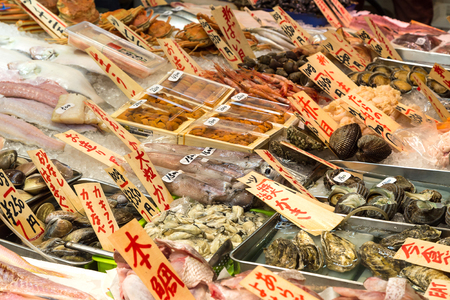 Kyoto, Japan - December 4, 2015: Various traditional Japanese food in Nishiki Market which is a five block long shopping street lined. Customers and tourists can shopping more than one hundred shops and restaurants.のeditorial素材