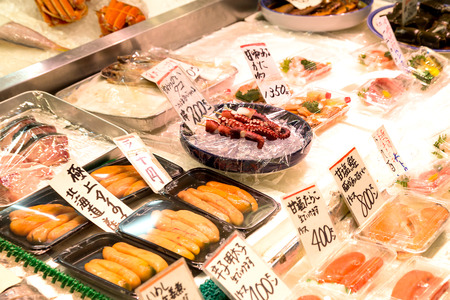 Kyoto, Japan - December 4, 2015: Various traditional Japanese food in Nishiki Market which is a five block long shopping street lined. Customers and tourists can shopping more than one hundred shops and restaurants.のeditorial素材