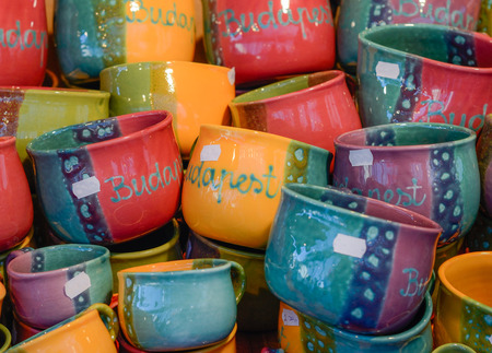 Christmas market in details. Colorful ceramic cups.