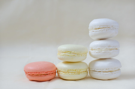 Macarons colored in pastel colors - white, yellow, pinkの写真素材